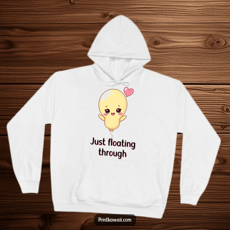 Funny Pastel Balloon Hoodie: A delightful pastel balloon character floats upwards with an infectious, cheerful expression, perfect for cozying up.